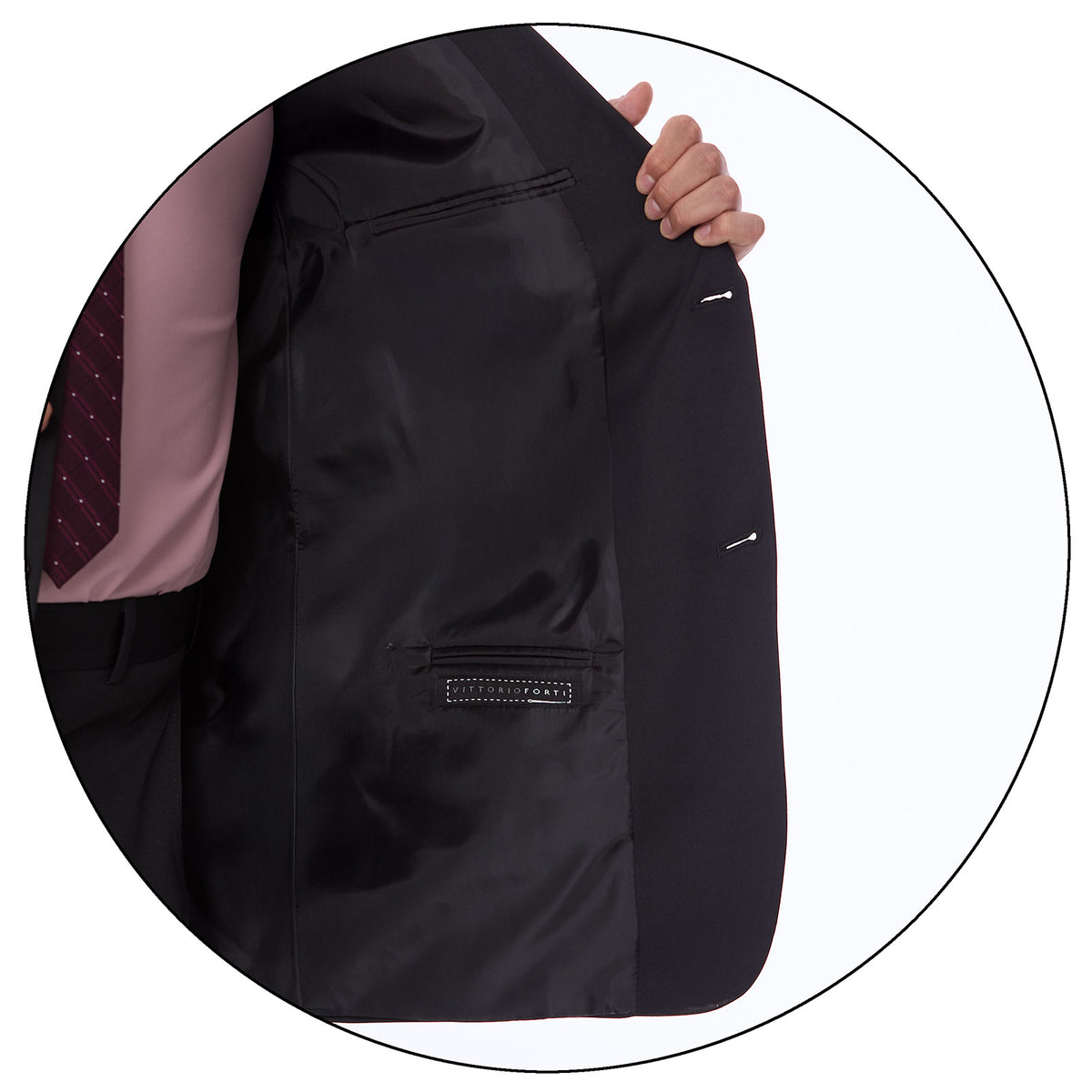 Primer plano de la textura de la tela del traje en color negro,con un ligero patrón de tejido visible (detalle de la tela).